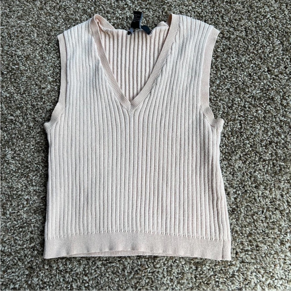 Light pink/tan sweater vest. Size medium.